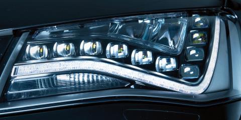 Lens produced using multi-layer injection molding (left final lens, right preform)