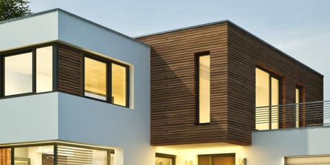 Modern architectural design showcasing a house with a striking blend of white and brown wood accents.