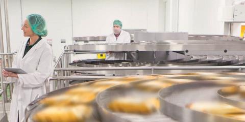 Workers on a packaging machine